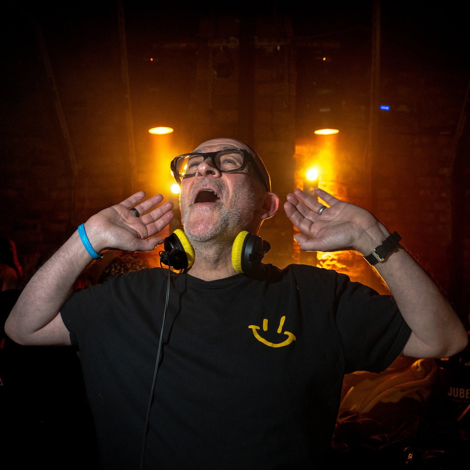 Graeme Park DJ professional head shot holding his hands to ears listening to the noise 